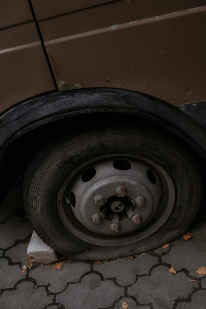 Close Up Photo of a Flat Tire